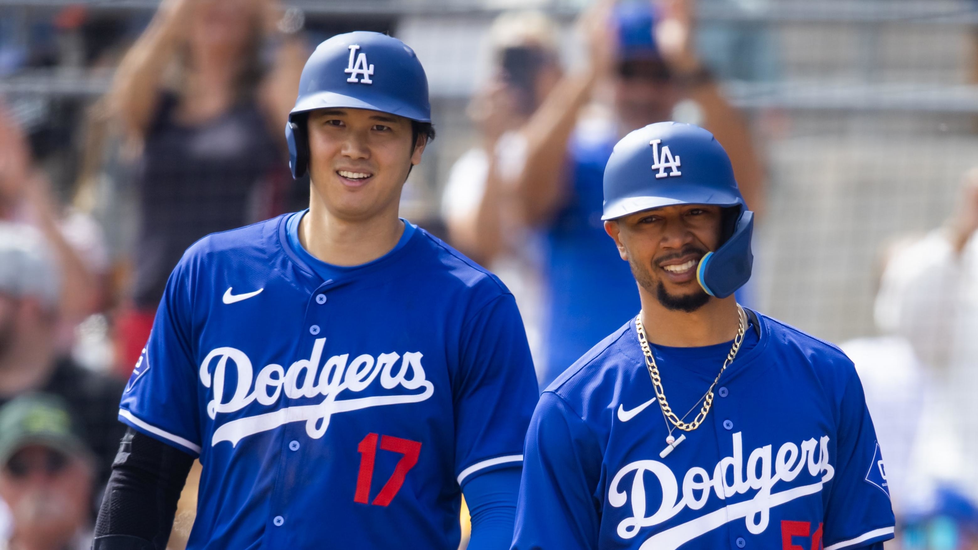 Mar 6, 2024; Phoenix, Arizona, USA; Los Angeles Dodgers designated hitter Shohei Ohtani (17) and shortstop Mookie Betts (50).