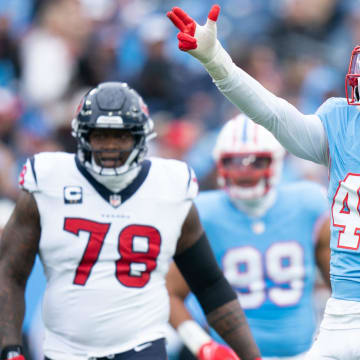 Tennessee Titans linebacker Arden Key (49) helps the referees with a Houston Texans penalty during their game at Nissan Stadium in Nashville, Tenn., Sunday, Dec. 17, 2023.