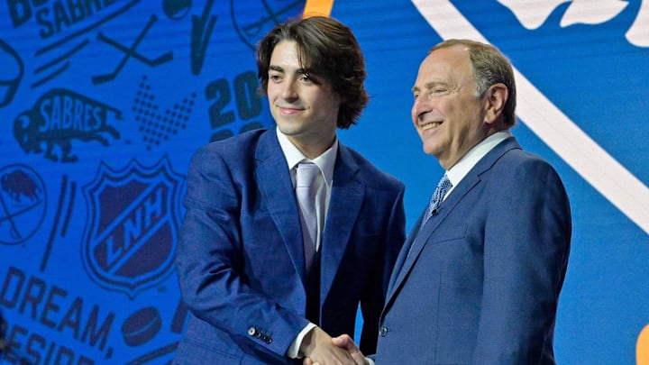 Jul 7, 2022; Montreal, Quebec, CANADA; Matthew Savoie shakes hands with NHL commissioner Gary Bettman after being selected as the number nine overall pick to the Buffalo Sabres in the first round of the 2022 NHL Draft at Bell Centre. Mandatory Credit: Eric Bolte-USA TODAY Sports