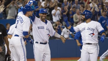 Jul 31, 2015; Toronto, Ontario, CAN; Toronto Blue Jays shortstop Troy Tulowitzki (2) and starting pitcher David Price (14) and right fielder Jose Bautista (19) celebrate the win during the eleventh inning in a game against the Kansas City Royals at Rogers Centre. The Toronto Blue Jays won 7-6. Mandatory Credit: Nick Turchiaro-USA TODAY Sports