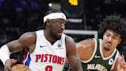 Detroit Pistons guard Caris Levert drives against Milwaukee Bucks center Jericho Sims.