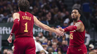 Jan 3, 2025; Dallas, Texas, USA;  Cleveland Cavaliers guard Donovan Mitchell (45) celebrates with Cleveland Cavaliers guard Max Strus (1) during the first half against the Dallas Mavericks at American Airlines Center. Mandatory Credit: Kevin Jairaj-Imagn Images