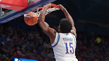 Kansas Jayhawks forward Bryson Tiller (15) jumps for a dunk during the second half of the exhibition game against Fort Hays State Tigers inside Allen Fieldhouse on Tuesday, October, 28, 2025.during the second half of the exhibition game against Fort Hays State Tigers inside Allen Fieldhouse on Tuesday, October, 28, 2025.