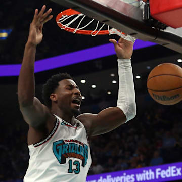 Apr 18, 2025; Memphis, Tennessee, USA; Memphis Grizzlies forward Jaren Jackson Jr. (13) dunks during the fourth quarter against the Dallas Mavericks at FedExForum. Mandatory Credit: Petre Thomas-Imagn Images