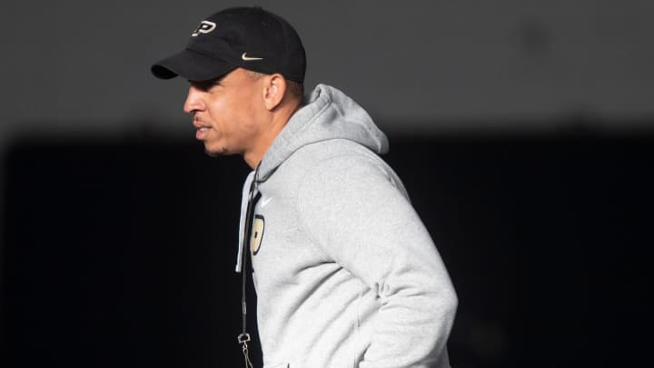 Purdue Boilermakers coach Ryan Walters jogs down field during Purdue football practice