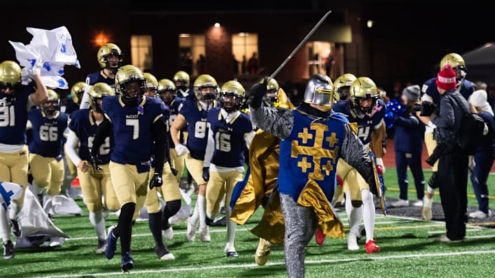 The Bishop McDevitt Crusaders take the field for the PIAA Class 5A football championship game against Roman Catholic at Cumberland Valley High School, Friday, Dec. 6, 2024, in Silver Spring Township, Pa. The Bishop McDevitt Crusaders take the field for the PIAA Class 5A football championship game against Roman Catholic at Cumberland Valley High School, Friday, Dec. 6, 2024, in Silver Spring Township, Pa.