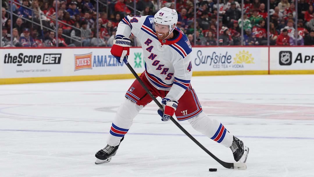 Mar 7, 2026; Newark, New Jersey, USA; New York Rangers defenseman Vladislav Gavrikov (44) takes a shot for a goal against the New Jersey Devils during the first period at Prudential Center. Mandatory Credit: Thomas Salus-Imagn Images