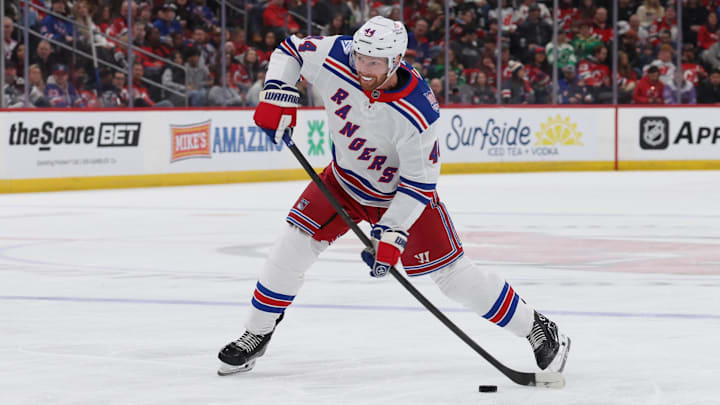 Mar 7, 2026; Newark, New Jersey, USA; New York Rangers defenseman Vladislav Gavrikov (44) takes a shot for a goal against the New Jersey Devils during the first period at Prudential Center. Mandatory Credit: Thomas Salus-Imagn Images