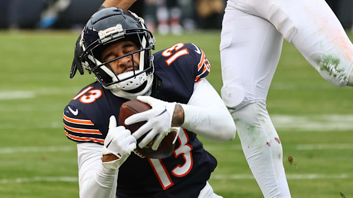 Dec 22, 2024; Chicago, Illinois, USA; Chicago Bears wide receiver Keenan Allen (13) makes a catch Detroit Lions safety Brian Branch (32) during the second half at Soldier Field. Mandatory Credit: Mike Dinovo-Imagn Images
