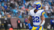 Nov 30, 2025; Charlotte, North Carolina, USA; Los Angeles Rams running back Blake Corum (22) celebrates after scoring a touchdown during the second quarter against the Carolina Panthers at Bank of America Stadium. Mandatory Credit: Jim Dedmon-Imagn Images