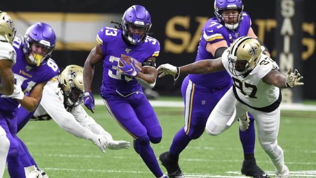 Jan 5, 2020; Minnesota Vikings running back Dalvin Cook (33) runs past New Orleans Saints defensive end Mario Edwards (97) 