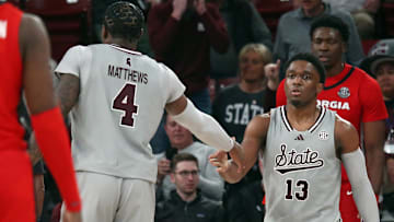 Feb 7, 2024; Starkville, Mississippi, USA; Mississippi State Bulldogs forward Cameron Matthews (4) reacts with Mississippi State Bulldogs guard Josh Hubbard (13) during the second half against the Georgia Bulldogs at Humphrey Coliseum. Mandatory Credit: Petre Thomas-Imagn Images