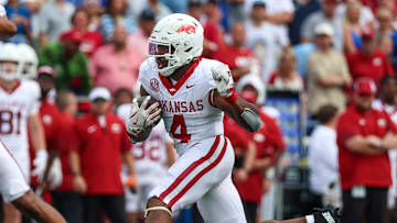 Sep 20, 2025; Memphis, Tennessee, USA; Arkansas Razorbacks running back Mike Washington Jr. (4) runs with the ball against the Memphis Tigers during the second half at Simmons Bank Liberty Stadium. Mandatory Credit: Wesley Hale-Imagn Images