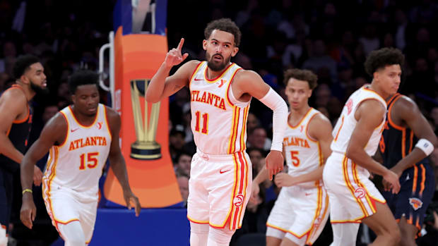 Atlanta Hawks guard Trae Young, center