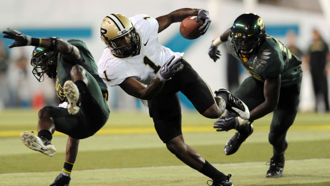Sept 12, 2009; Eugene, OR, USA; Purdue Boilermakers wide receiver Keith Carlos (1) avoids the tackle of Oregon Ducks cornerback Walter Thurmond III (6) in the second quarter of the game at Autzen Stadium. Sept 12, 2009; Eugene, OR, USA; Purdue Boilermakers wide receiver Keith Carlos (1) avoids the tackle of Oregon Ducks cornerback Walter Thurmond III (6) in the second quarter of the game at Autzen Stadium.