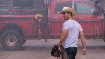 Tyler Owens, a self-declared tornado wrangler from Arkansas played by Glenn Powell, heads to his truck after visiting Kate, played by Daisy Edgar-Jones, at her mother's house in Oklahoma in the movie "Twisters."