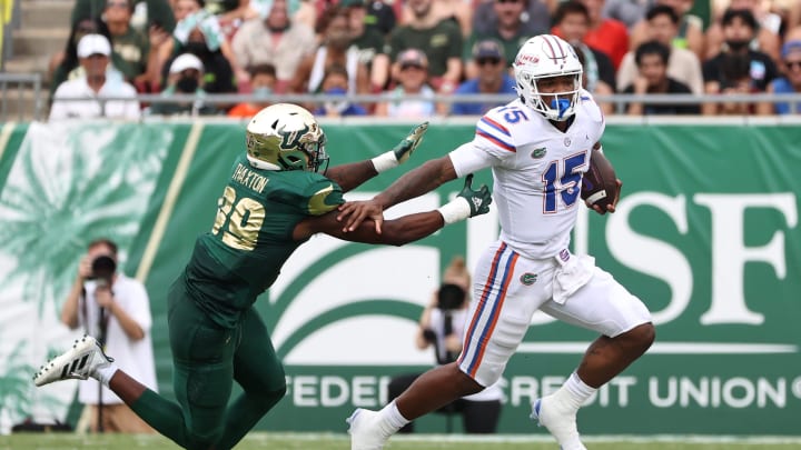 Florida Gators quarterback Anthony Richardson (15) still arms South Florida Bulls defensive end Ryan Thaxton (99) during the second quarter at Raymond James Stadium in Tampa, FL on Saturday, September 11, 2021.

Flgai 091121 Gatorsfb Usf 7436 Mattpendleton