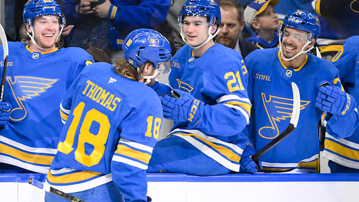 Jan 3, 2026; St. Louis, Missouri, USA; St. Louis Blues center Robert Thomas (18) is congratulated by left wing Jake Neighbours (63) right wing Jimmy Snuggerud (21) and right wing Mathieu Joseph (71) after scoring a shorthanded goal against the Montreal Canadiens during the second period at Enterprise Center. Mandatory Credit: Jeff Curry-Imagn Images