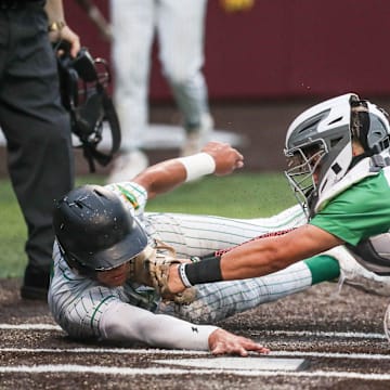 Falfurrias’ Ben Benavides tags Bishop runner Matt Reyna out at home during Game 1 of the Class 3A Division I area baseball playoff series on May 8, 2025, in Corpus Christi, Texas.