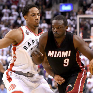 May 3, 2016; Toronto, Ontario, CAN;   Miami Raptors gorward Luol Deng (9) dribbles the ball past Toronto Raptors guard DeMar DeRozan (10) in game one of the second round of the NBA Playoffs at Air Canada Centre.The Heat won 102-96 in overtime. Mandatory Credit: Dan Hamilton-USA TODAY Sports