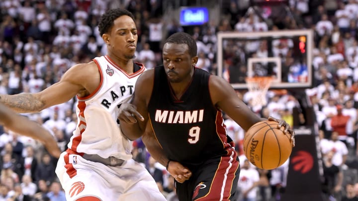 May 3, 2016; Toronto, Ontario, CAN;   Miami Raptors gorward Luol Deng (9) dribbles the ball past Toronto Raptors guard DeMar DeRozan (10) in game one of the second round of the NBA Playoffs at Air Canada Centre.The Heat won 102-96 in overtime. Mandatory Credit: Dan Hamilton-USA TODAY Sports