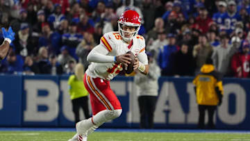 Nov 17, 2024; Orchard Park, New York, USA; Kansas City Chiefs quarterback Patrick Mahomes (15) rolls out against the Buffalo Bills during the second half at Highmark Stadium. Mandatory Credit: Gregory Fisher-Imagn Images