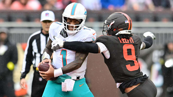Oct 19, 2025; Cleveland, Ohio, USA; Cleveland Browns safety Grant Delpit (9) sacks Miami Dolphins quarterback Tua Tagovailoa (1) during the first half at Huntington Bank Field. Mandatory Credit: Ken Blaze-Imagn Images
