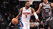 Jan 8, 2025; Brooklyn, New York, USA;  Detroit Pistons guard Malik Beasley (5) looks to drive past Brooklyn Nets forward Jalen Wilson (22) in the first quarter at Barclays Center. Mandatory Credit: Wendell Cruz-Imagn Images