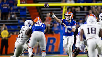 Sep 14, 2024; Gainesville, Florida, USA; Florida Gators quarterback Graham Mertz (15) throws the ball under pressure against the Texas A&M Aggies during the second half at Ben Hill Griffin Stadium. Mandatory Credit: Matt Pendleton-Imagn Images