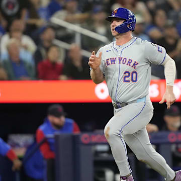 Sep 9, 2024; Toronto, Ontario, CAN; New York Mets first baseman Pete Alonso (20) scores on a single by designated hitter J.D. Martinez (not pictured) against the Toronto Blue Jays during the fourth inning at Rogers Centre. Mandatory Credit: John E. Sokolowski-Imagn Images