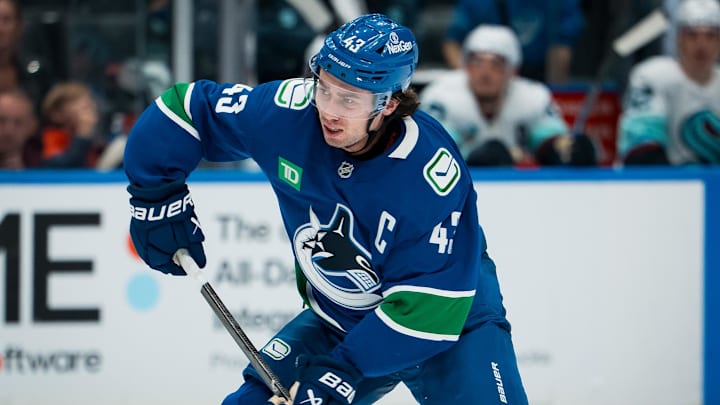 Sep 26, 2025; Vancouver, British Columbia, CAN; Vancouver Canucks defenseman Quinn Hughes (43) handles the puck against the Seattle Kraken in the third period at Rogers Arena. Mandatory Credit: Bob Frid-Imagn Images