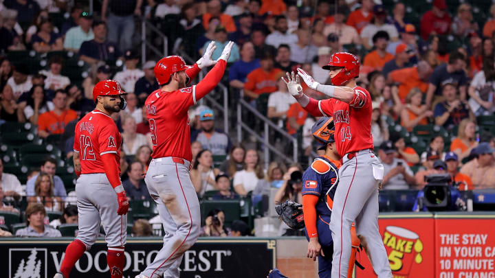 May 20, 2024; Houston, Texas, USA; Los Angeles Angels catcher Logan O'Hoppe (14) is congratulated by Los Angeles Angels left fielder Taylor Ward (3) after hitting a three-run home run against the Houston Astros during the fifth inning at Minute Maid Park. Mandatory Credit: Erik Williams-USA TODAY Sports