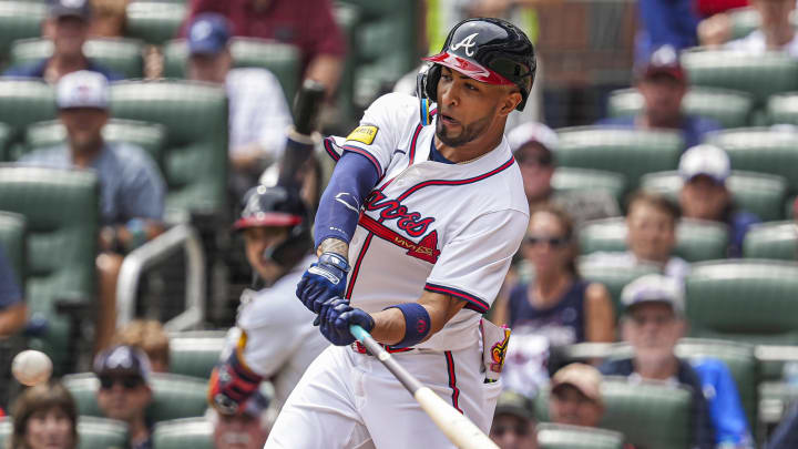 Jul 20, 2024; Cumberland, GA, USA; Atlanta Braves left fielder Eddie Rosario (8) hits a two run game tying home run against the St. Louis Cardinals during the seventh inning at Truist Park. Mandatory Credit: Dale Zanine-USA TODAY Sports