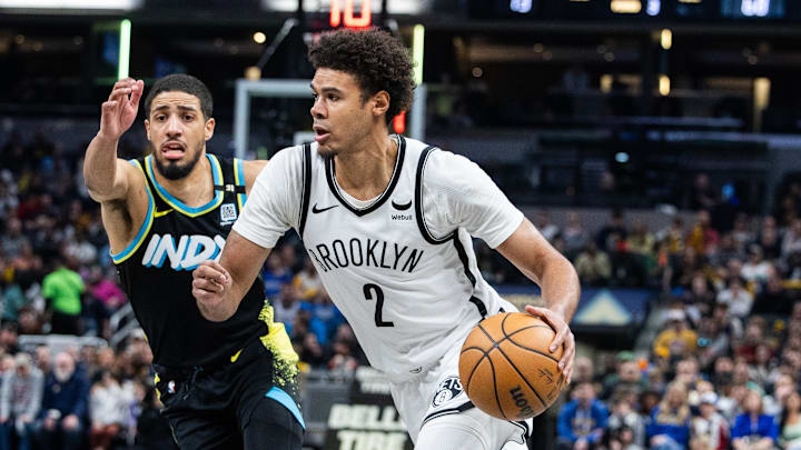 Mar 16, 2024; Indianapolis, Indiana, USA; Brooklyn Nets forward Cameron Johnson (2) dribbles the ball while Indiana Pacers guard Tyrese Haliburton (0) defends in the second half at Gainbridge Fieldhouse. Mandatory Credit: Trevor Ruszkowski-Imagn Images