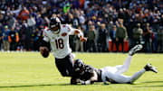 Oct 26, 2025; Baltimore, Maryland, USA; Chicago Bears quarterback Caleb Williams (18) is sacked by Baltimore Ravens linebacker Mike Green (45) during the first quarter at M&T Bank Stadium. Mandatory Credit: Geoff Burke-Imagn Images