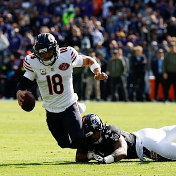 Oct 26, 2025; Baltimore, Maryland, USA; Chicago Bears quarterback Caleb Williams (18) is sacked by Baltimore Ravens linebacker Mike Green (45) during the first quarter at M&T Bank Stadium. Mandatory Credit: Geoff Burke-Imagn Images