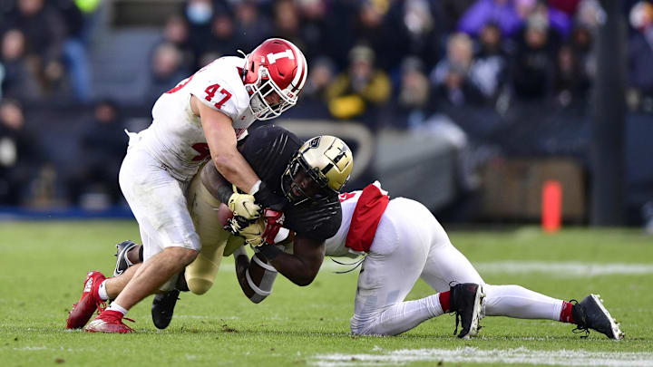 Purdue Boilermakers running back King Doerue (22) is tackled by Indiana Hoosiers linebacker Micah McFadden (47) and Indiana Hoosiers defensive back Marcelino McCrary-Ball (9) during the second quarter at Ross-Ade Stadium. Purdue Boilermakers running back King Doerue (22) is tackled by Indiana Hoosiers linebacker Micah McFadden (47) and Indiana Hoosiers defensive back Marcelino McCrary-Ball (9) during the second quarter at Ross-Ade Stadium.