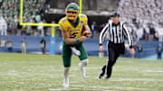 North Dakota State Bison quarterback Trey Lance (5) runs the ball in the first quarter against the James Madison Dukes at Toyota Stadium.