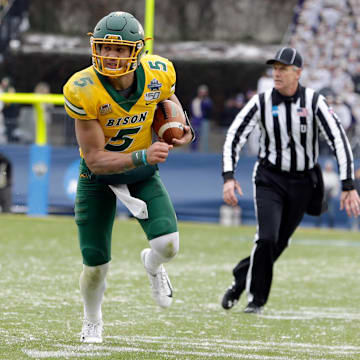 North Dakota State Bison quarterback Trey Lance (5) runs the ball in the first quarter against the James Madison Dukes at Toyota Stadium.