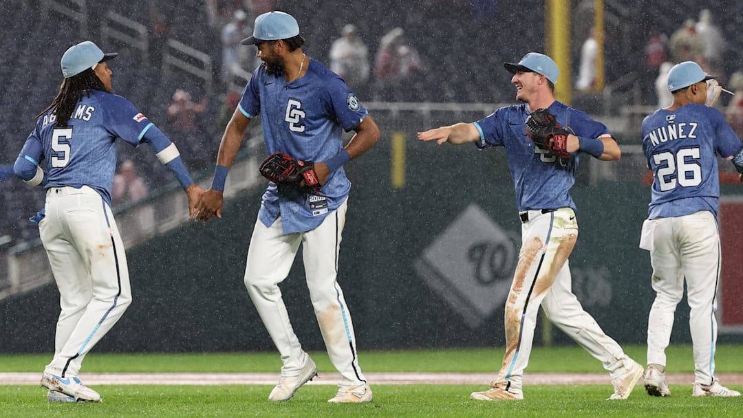 Sep 27, 2025; Washington, District of Columbia, USA; Washington Nationals outfielder James Wood (29) and Nationals outfielder Jacob Young (30) celebrate with Nationals shortstop CJ Abrams (5) after their game against the Chicago White Sox at Nationals Park. 