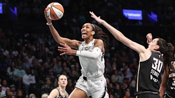 Oct 1, 2024; Brooklyn, New York, USA; Las Vegas Aces center A'ja Wilson (22) and New York Liberty forward Breanna Stewart (30) during game two of the 2024 WNBA Semi-finals at Barclays Center. Mandatory Credit: Wendell Cruz-Imagn Images
