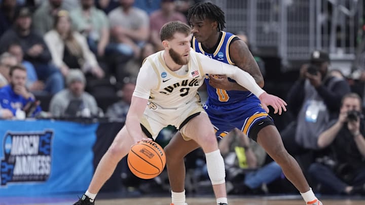 Mar 22, 2025; Providence, RI, USA; Purdue Boilermakers guard Braden Smith (3) dribbles against McNeese State Cowboys guard T'Johnn Brown (0) during the first half of a second round men’s NCAA Tournament game at Amica Mutual Pavilion. Mandatory Credit: Gregory Fisher-Imagn Images