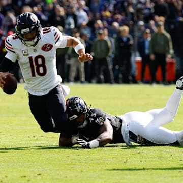 Oct 26, 2025; Baltimore, Maryland, USA; Chicago Bears quarterback Caleb Williams (18) is sacked by Baltimore Ravens linebacker Mike Green (45) during the first quarter at M&T Bank Stadium. Mandatory Credit: Geoff Burke-Imagn Images