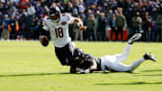Oct 26, 2025; Baltimore, Maryland, USA; Chicago Bears quarterback Caleb Williams (18) is sacked by Baltimore Ravens linebacker Mike Green (45) during the first quarter at M&T Bank Stadium. Mandatory Credit: Geoff Burke-Imagn Images