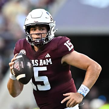 Aug 31, 2024; College Station, Texas, USA; Texas A&M Aggies quarterback Conner Weigman (15) runs the ball during the first half against the Notre Dame Fighting Irish at Kyle Field. Mandatory Credit: Maria Lysaker-Imagn Images