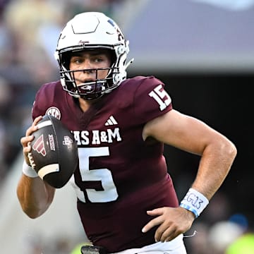 Aug 31, 2024; College Station, Texas, USA; Texas A&M Aggies quarterback Conner Weigman (15) runs the ball during the first half against the Notre Dame Fighting Irish at Kyle Field. 