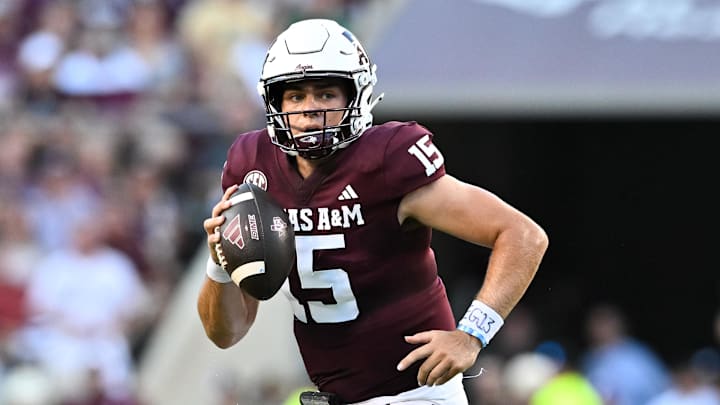 Aug 31, 2024; College Station, Texas, USA; Texas A&M Aggies quarterback Conner Weigman (15) runs the ball during the first half against the Notre Dame Fighting Irish at Kyle Field. 