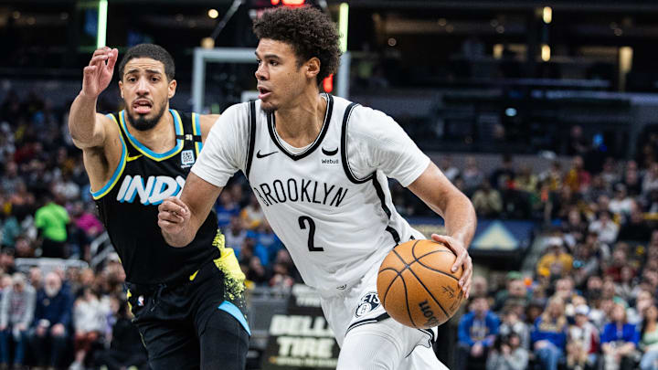 Mar 16, 2024; Indianapolis, Indiana, USA; Brooklyn Nets forward Cameron Johnson (2) dribbles the ball while Indiana Pacers guard Tyrese Haliburton (0) defends in the second half at Gainbridge Fieldhouse.