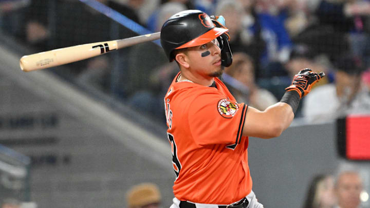 Mar 29, 2025; Toronto, Ontario, CAN;  Baltimore Orioles third baseman Ramon Urias (29) hits a three RBI double against the Toronto Blue Jays in the fourth inning at Rogers Centre. 