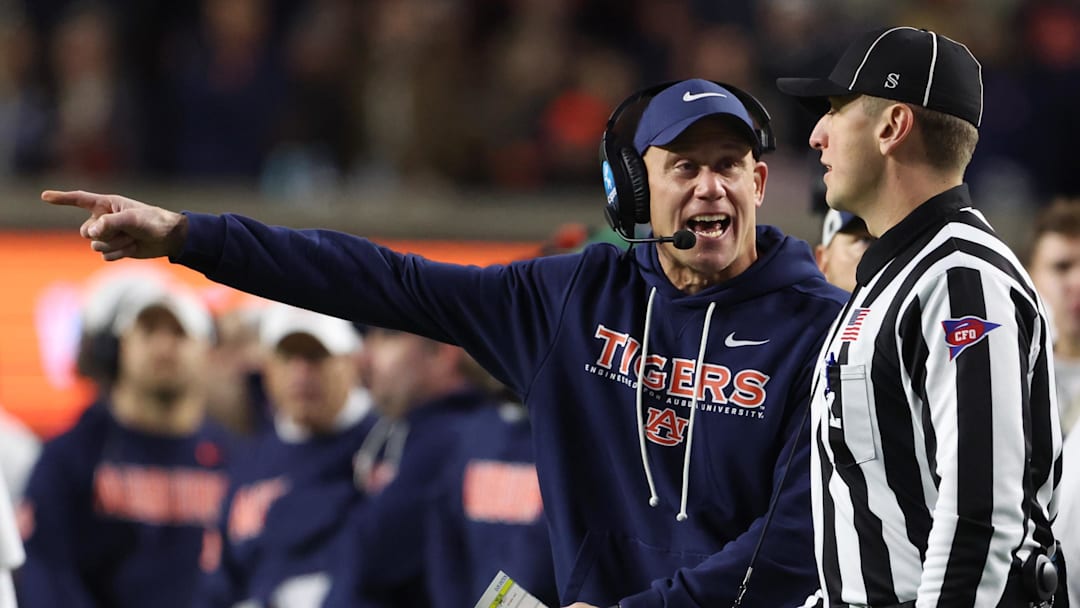 Nov 29, 2025; Auburn, Alabama, USA; Auburn Tigers interim head coach DJ Durkin talks to a referee during the second half against the Alabama Crimson Tide at Jordan-Hare Stadium. Mandatory Credit: John Reed-Imagn Images